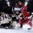Russlands Sergei Andronov kämpft mit den Letten Ronalds Kenins und TOrhüter Ivars Punnenovs vor dem Tor. Foto: Andre Ringuette / HHOF-IIHF Images
